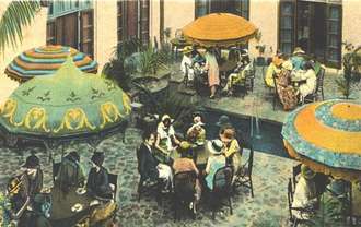 Hotel guests taking tea in the courtyard