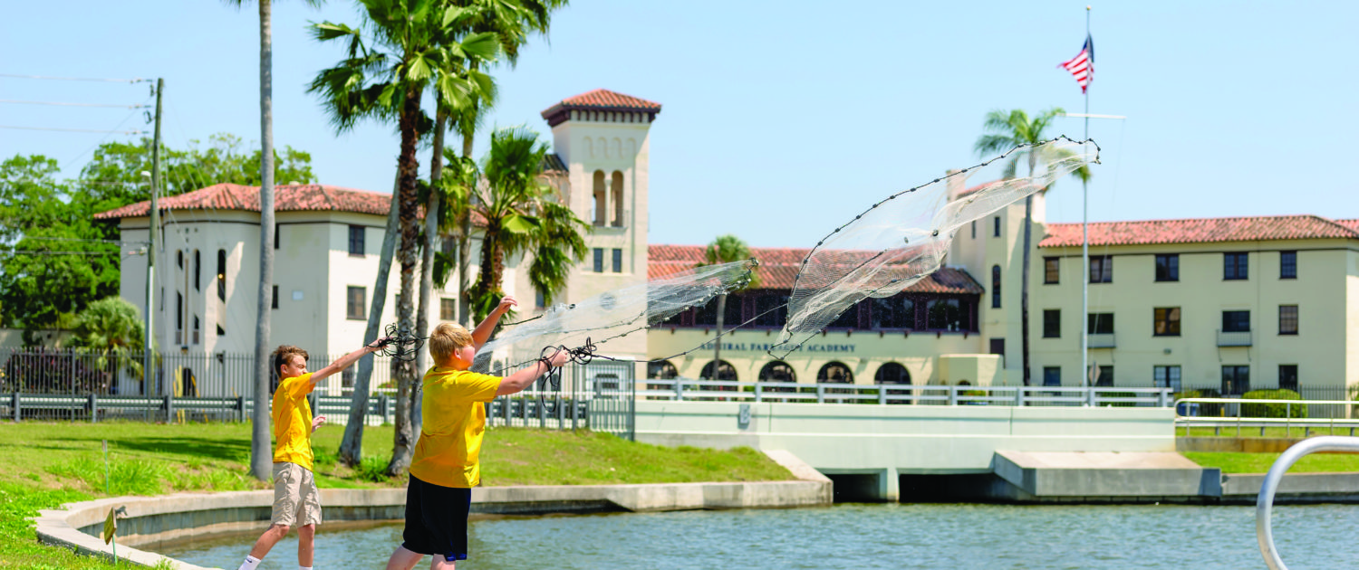 Lower School students cast netting on Admiral Farragut Academy's waterfront on Boca Ciega Bay